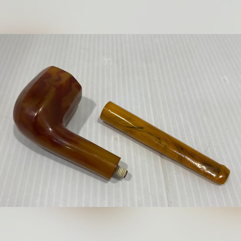 Vintage yellow and brown, bakelite pipe.