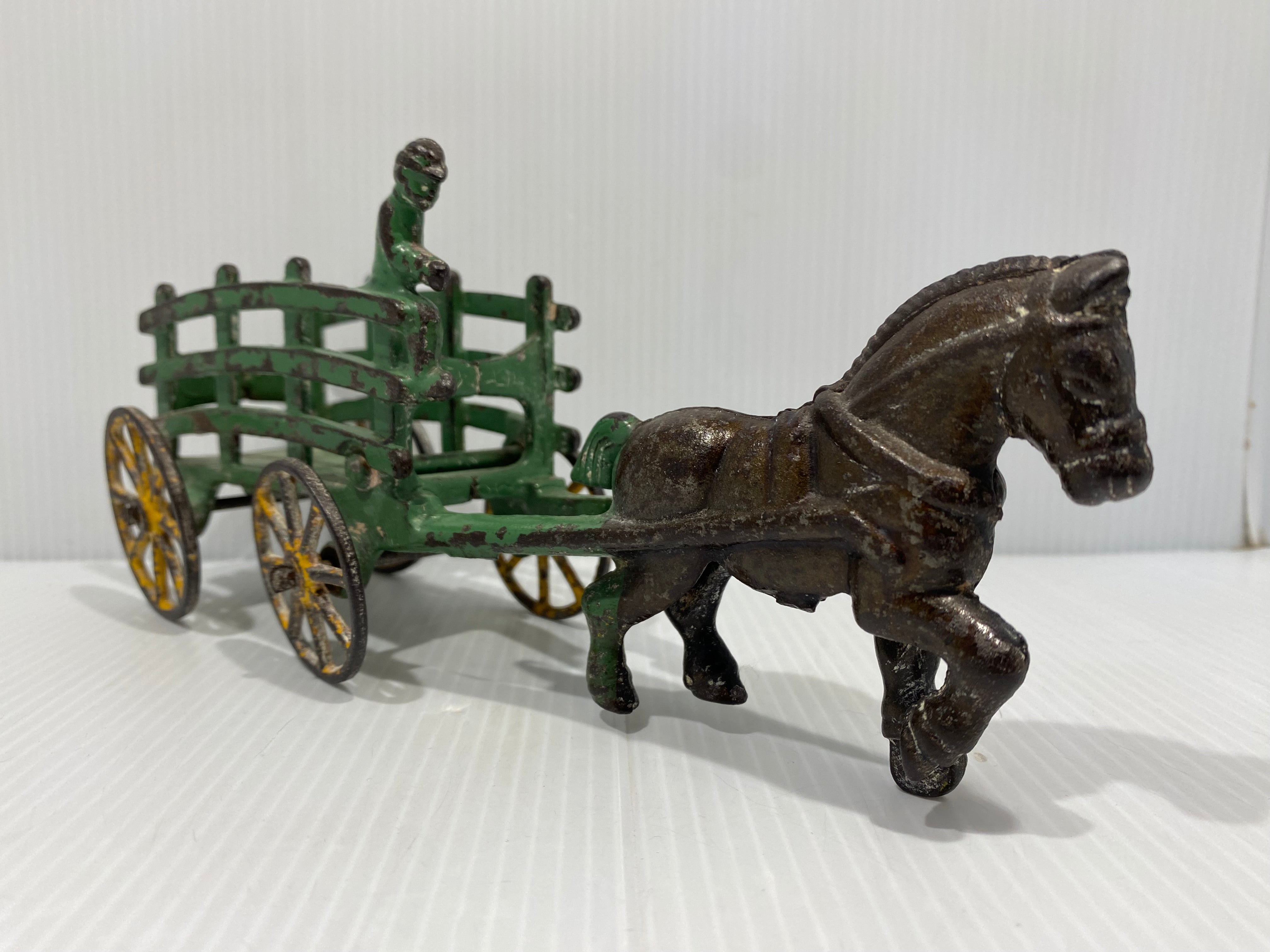 Original Green, stake wagons with cast in drivers. No cracks or repairs.