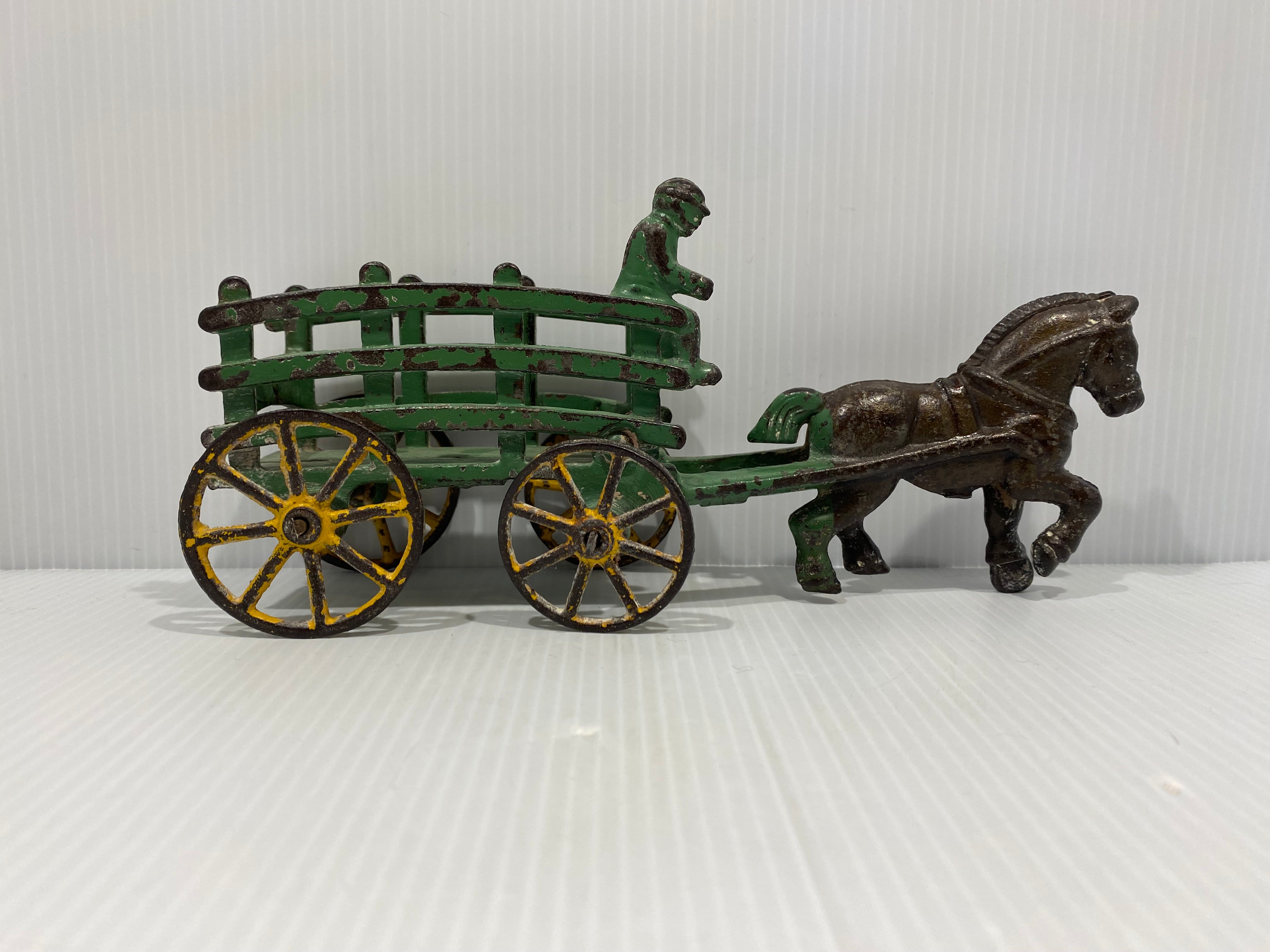 Original Green, stake wagons with cast in drivers. No cracks or repairs.