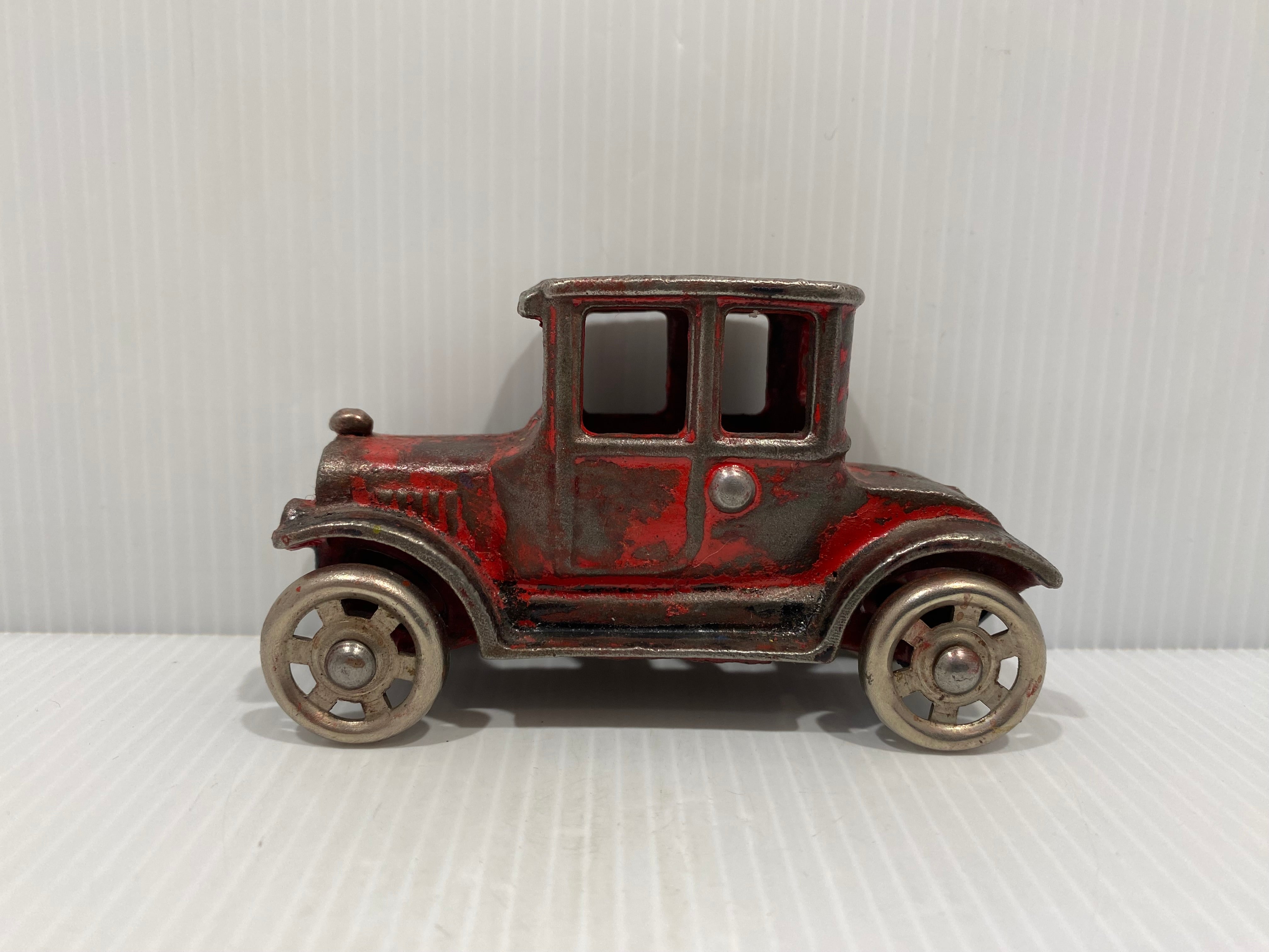 Manufactured by Arcade in the 1920s, this little cast iron car is based on a Ford Model T coupe.
