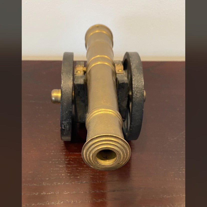 Vintage, early 20th century, brass signal Cannon with cast iron wells and base.