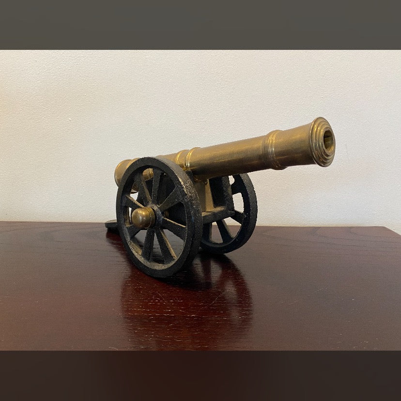 Vintage, early 20th century, brass signal Cannon with cast iron wells and base.