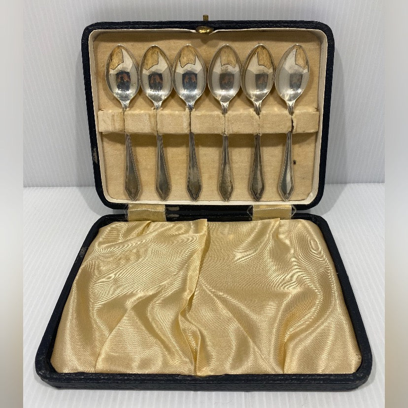 A cased set of six silver teaspoons hallmarked , maker EJE.