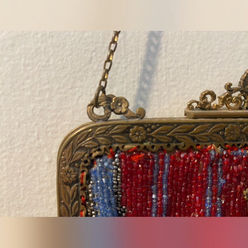 Beautiful art deco , 1930s, red glass beaded purse, ornate bronze frame with two semi precious blu stone.