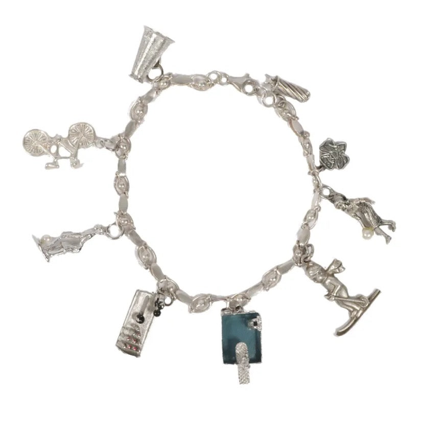 Beautiful, vintage , Girl Scouts / sports themed sterling silver charm bracelet with 9 charms.
