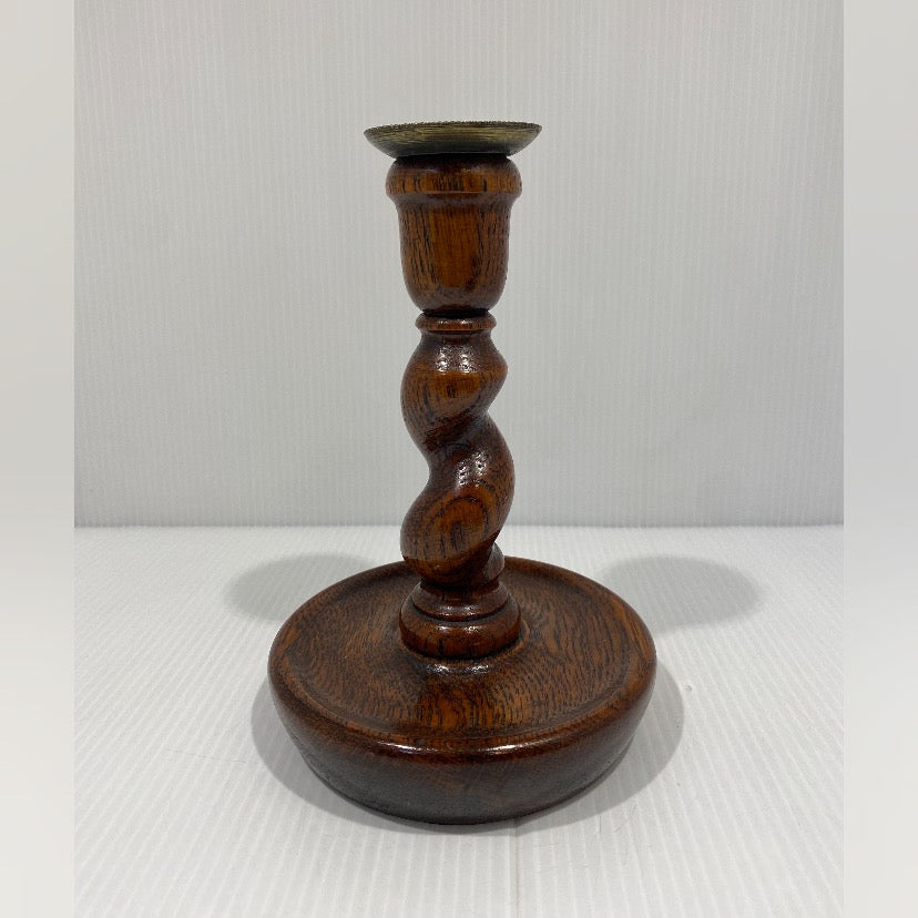 Pair of antique twisted turned wood candlesticks with bronze iron wax catchers and felted base.