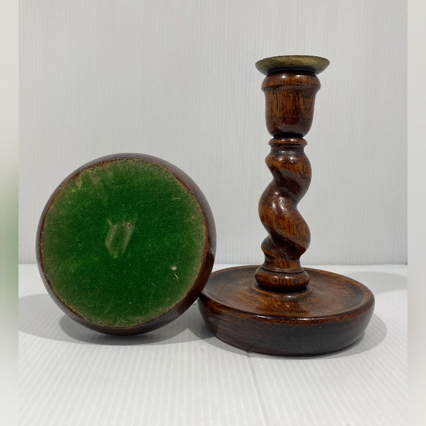 Pair of antique twisted turned wood candlesticks with bronze iron wax