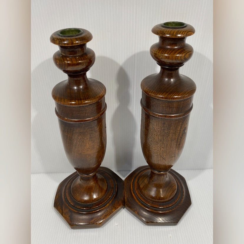 Pair of antique turned wood candlesticks in Mahogany