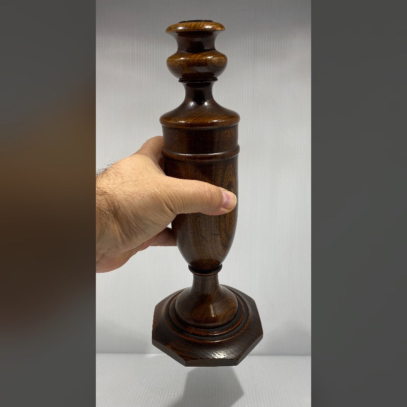 Pair of antique turned wood candlesticks in Mahogany