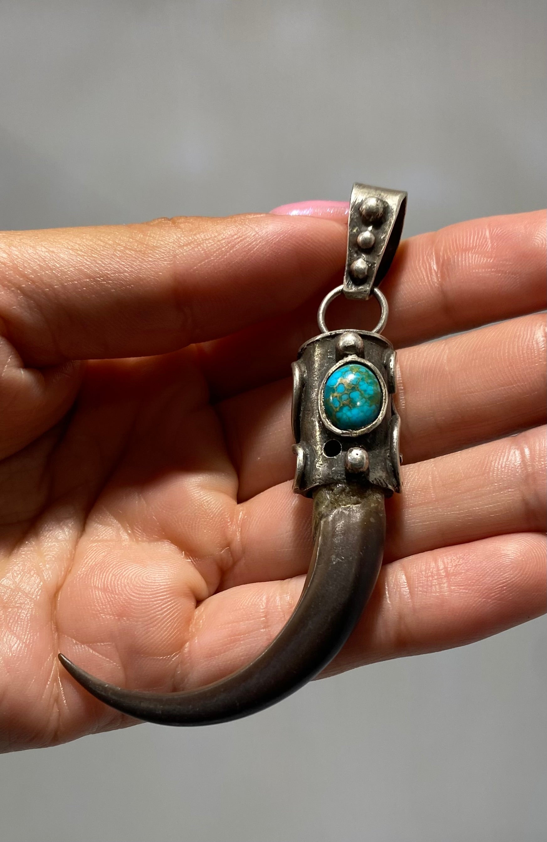 Vintage, Native American Navajo, Eagle claw with turquoise eye and sterling silver pendant.