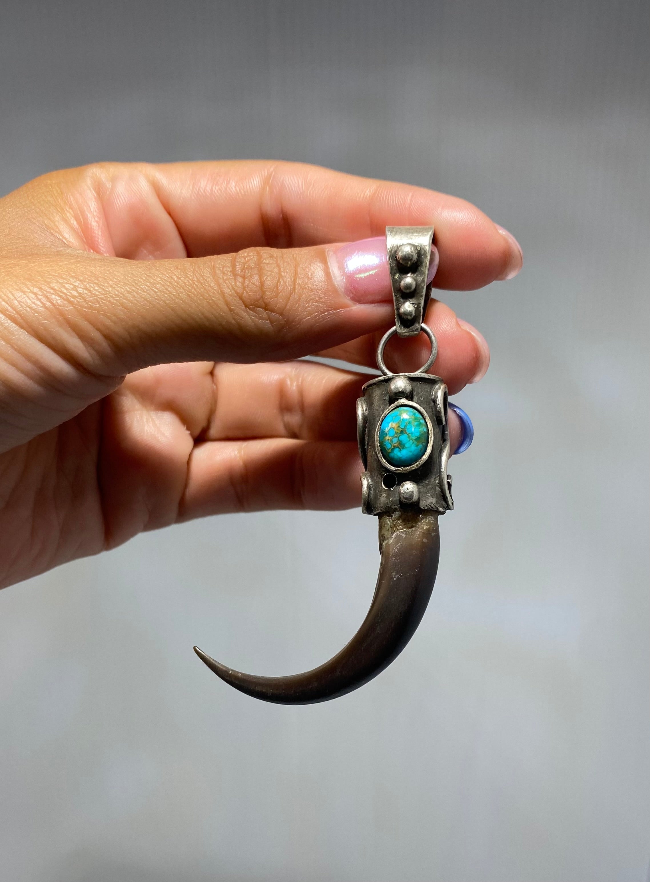 Vintage, Native American Navajo, Eagle claw with turquoise eye and sterling silver pendant.
