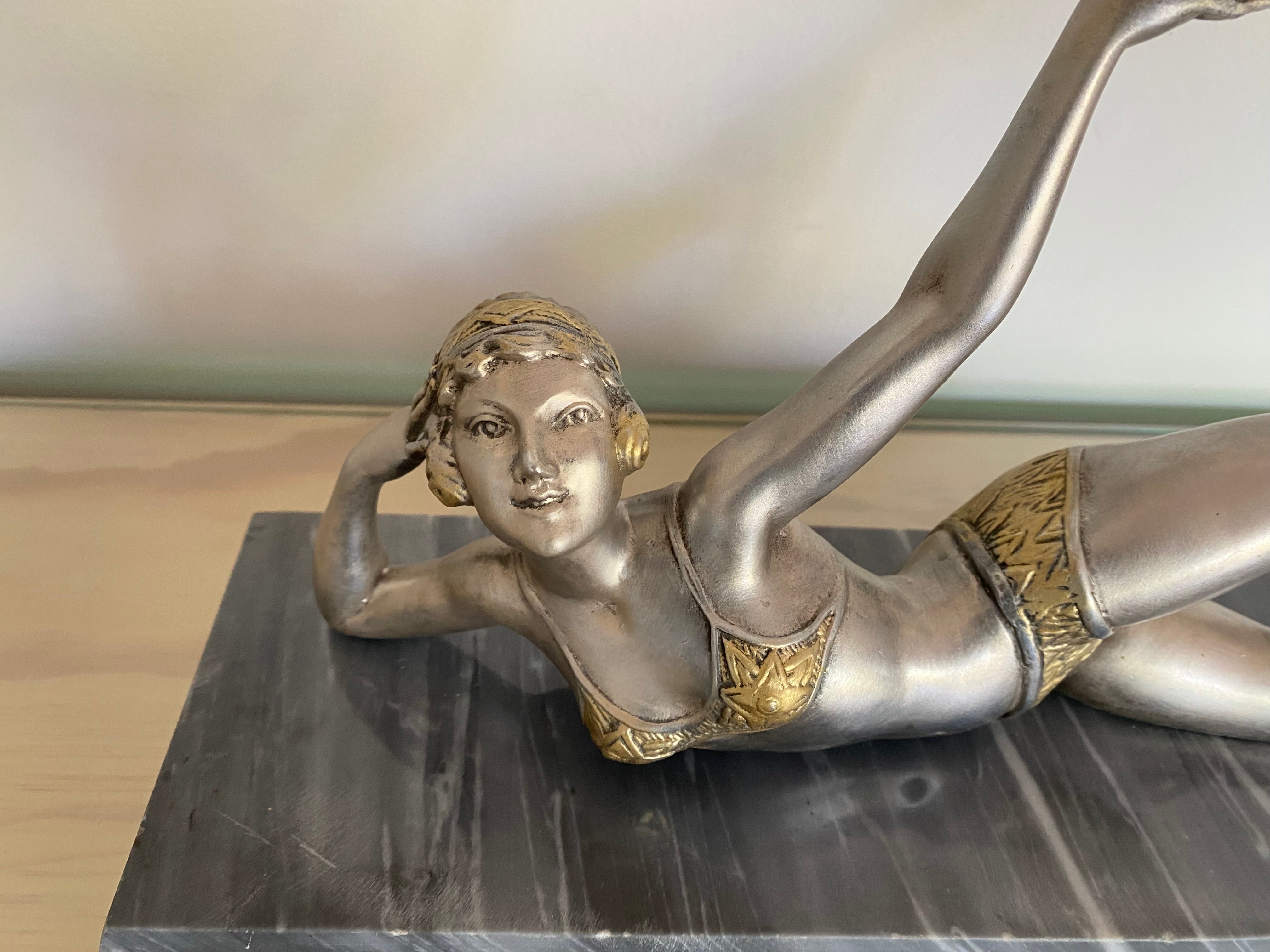 Beautiful, Art Deco spelter figure, c1930, France, the young woman dressed in a top and shorts, holding a ball,