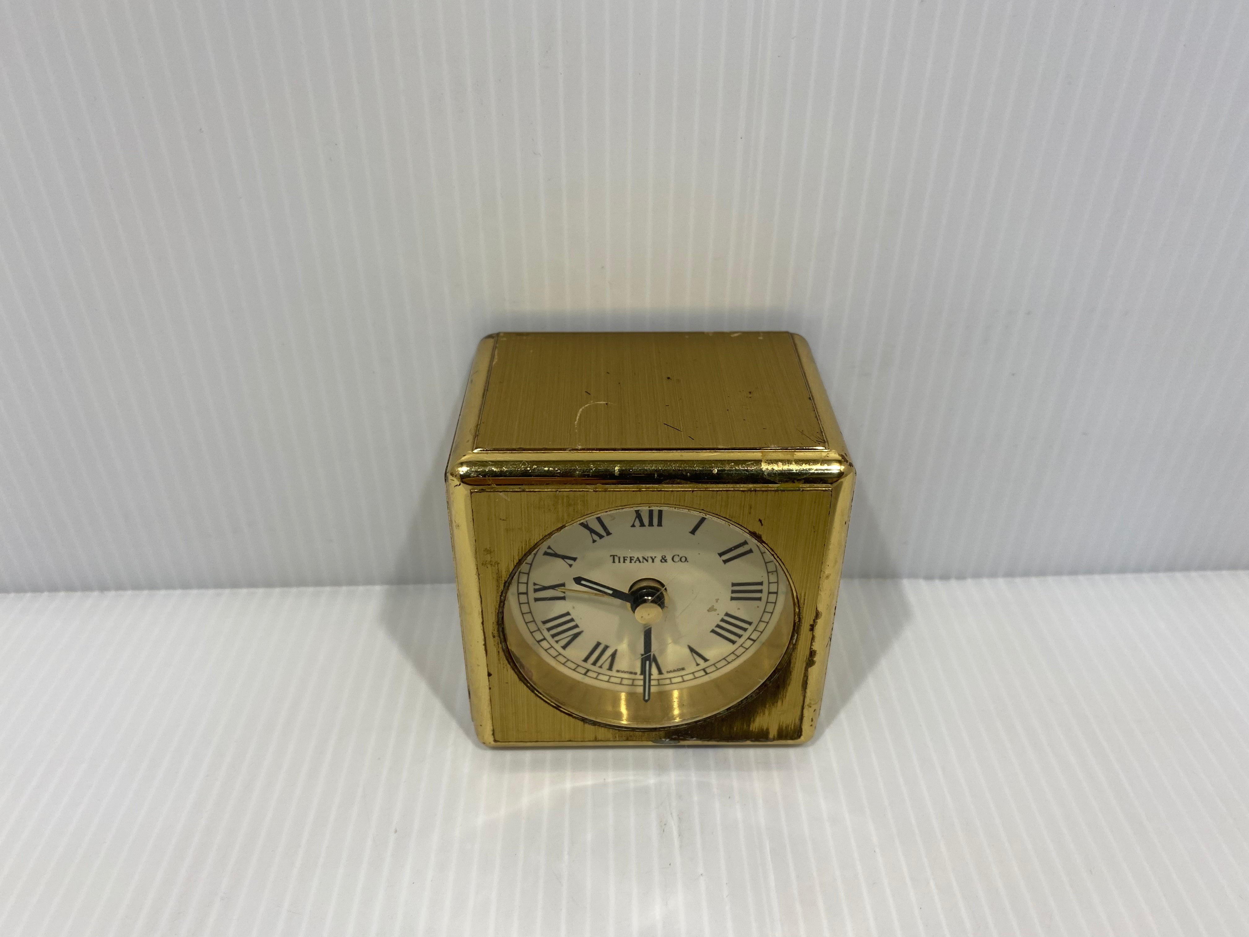 Tiffany & Co. solid brass collectible cube clock. Made of heavy thick brass with quartz clock and Alarm