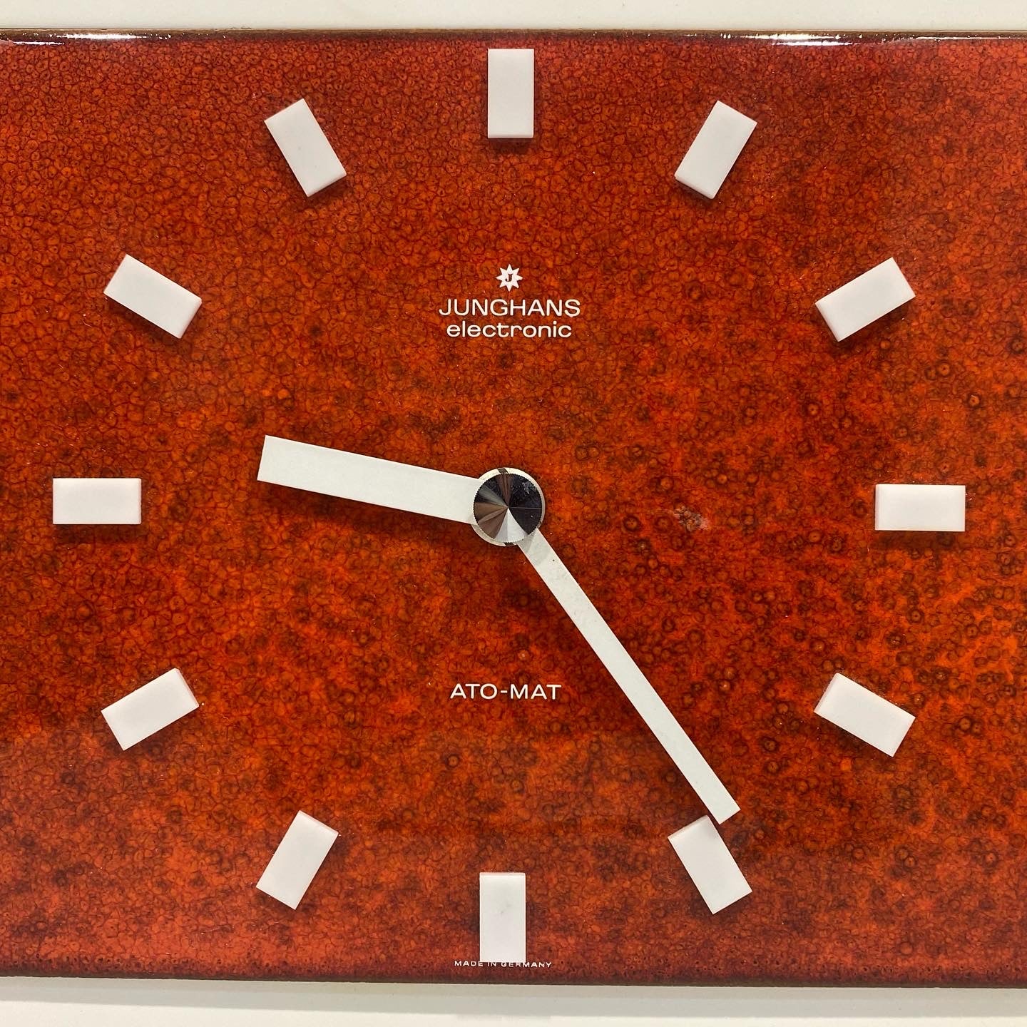 Elegant and a rare vintage Junghans ceramic wall clock with wooden base.