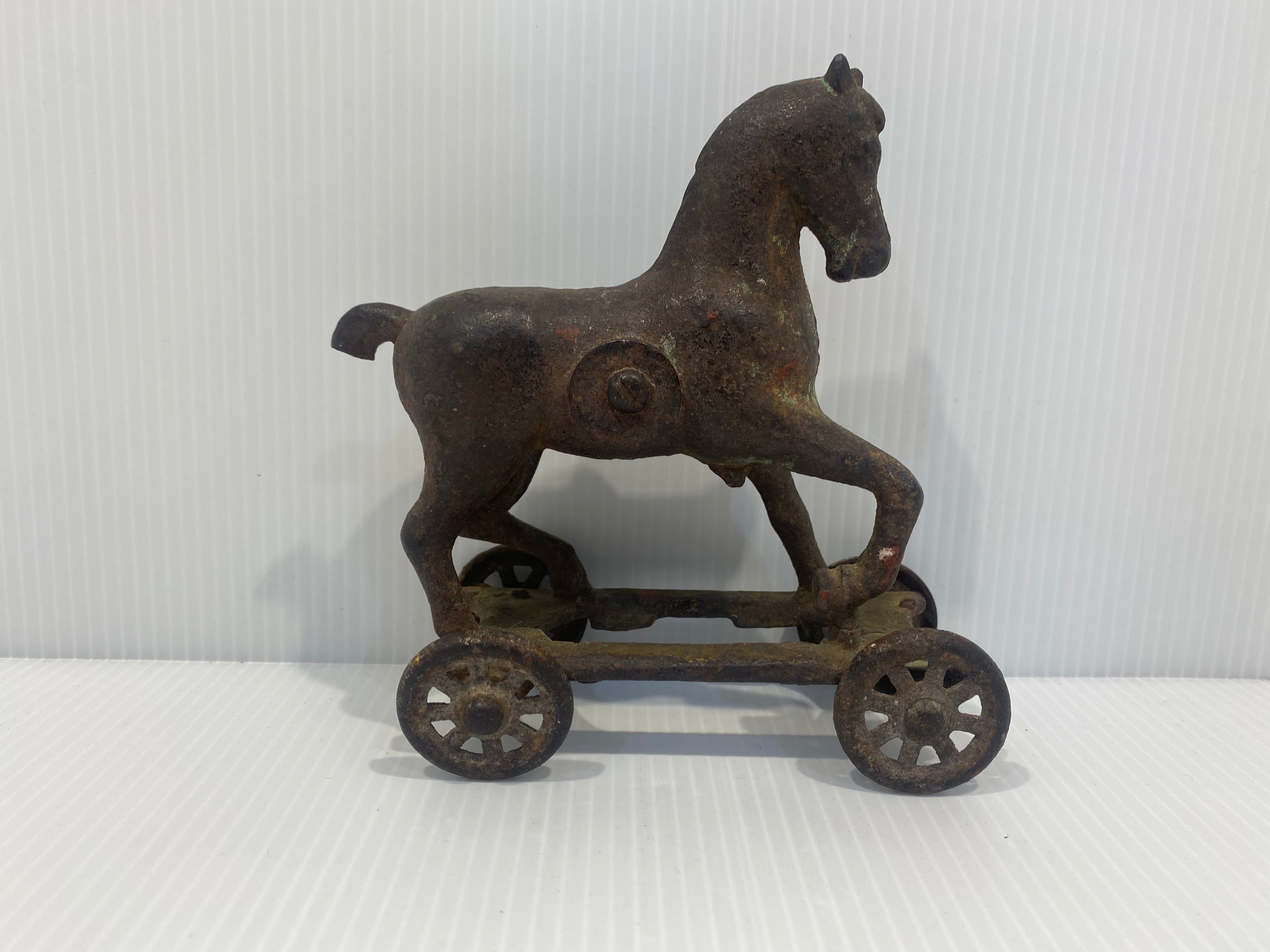 old still bank of horse on wheels. 1875