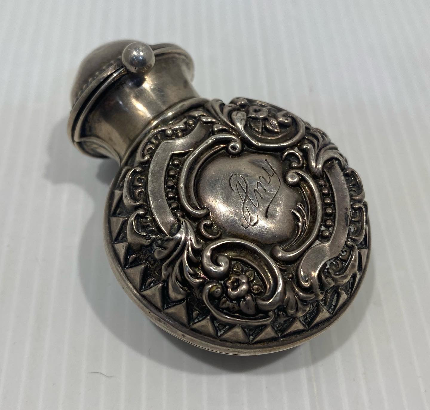 Beautiful antique sterling silver vinaigrette ( Perfume bottle in silver holder ).