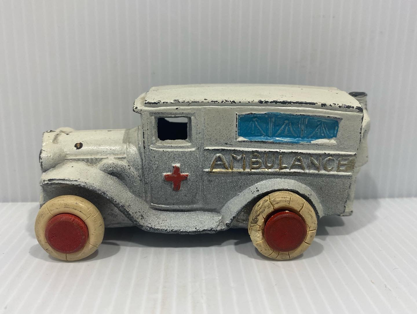 Rare Antique Savoye Pewter Toy Company Ambulance Car with a cast-in attendant perched precariously on the rear step